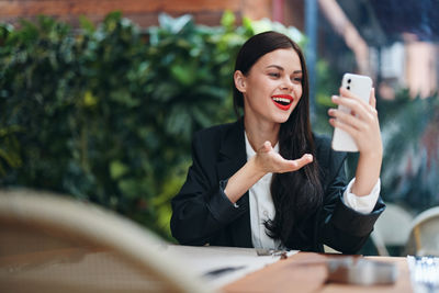 Young woman using mobile phone