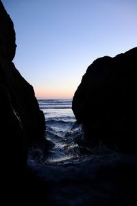 Scenic view of sea against clear sky during sunset