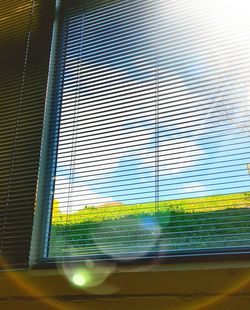 Low angle view of glass window against building