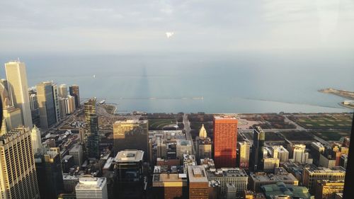 Aerial view of cityscape against sky