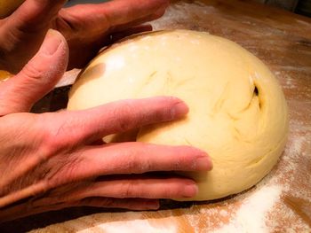 Close-up of cropped hand holding food