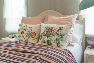 High angle view of sofa relaxing on bed at home