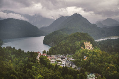 Scenic view of mountains and buildings against sky