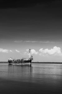 Ship on sea against sky