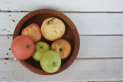 High angle view of apples in container on table