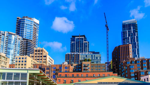 Low angle view of modern buildings against sky