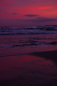 Scenic view of sea against romantic sky at sunset