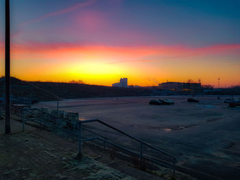 Scenic view of buildings against sky during sunset