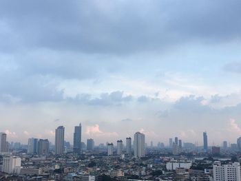 Aerial view of city buildings against sky