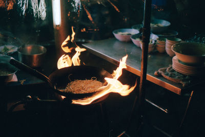 Close-up of noodles on barbecue grill. china town.