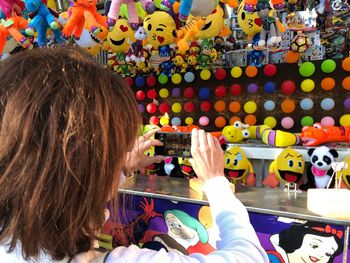 Rear view of woman with toy toys