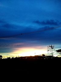 Silhouette landscape against sky during sunset