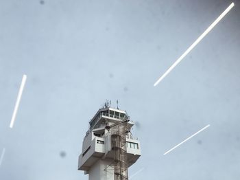 Low angle view of vapor trails in sky