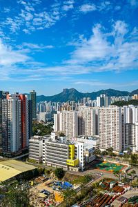 High angle view of buildings in city against sky