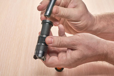 Close-up of man working on metal