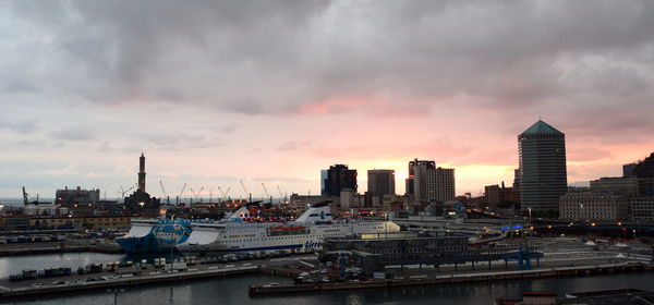 Buildings in city at sunset