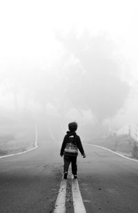 Woman walking on road