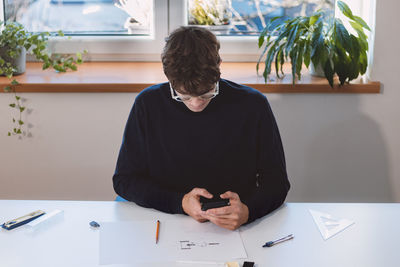 Goal-oriented businessman is on the phone with his supervisor and talks about his visions