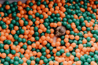 High angle view of various ball in container