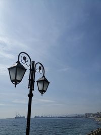 Low angle view of street light against sky