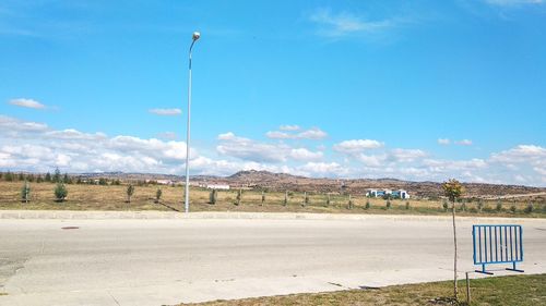 Road by land against sky