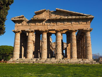 Old ruins of temple against clear blue sky