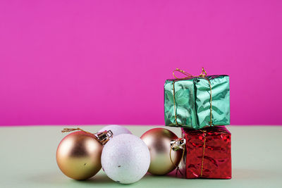 Close-up of christmas decoration against yellow background