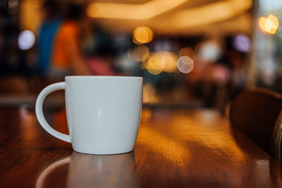 Close-up of coffee served on table at cafe