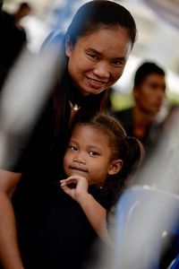 Portrait of smiling mother and daughter