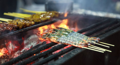 Close-up of meat on barbecue grill