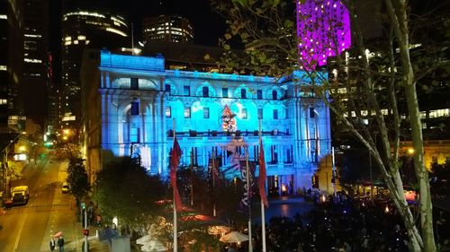 Crowd on illuminated city at night