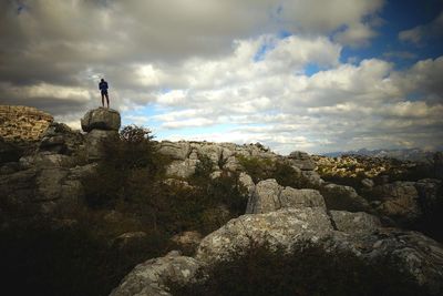 Scenic view of landscape against cloudy sky