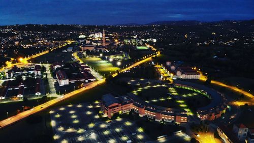 High angle view of illuminated city buildings at night