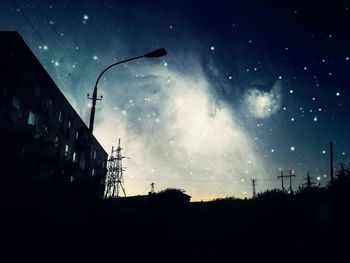 Low angle view of built structure against sky at night