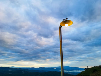 Low angle view of street light against sky