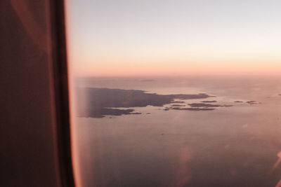 Scenic view of sea against sky at sunset