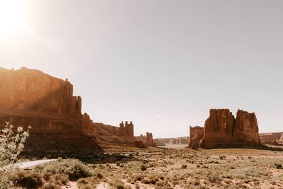 Rock formations on landscape against clear sky