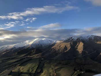 Scenic view of snowcapped mountains against sky