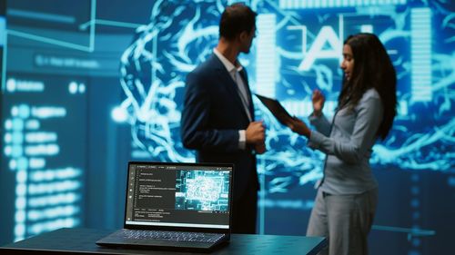 Side view of business colleagues working in office