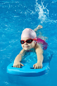 Woman swimming in pool