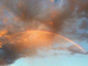 Low angle view of rainbow against sky