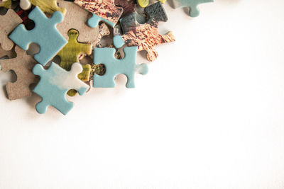 High angle view of cake on table against white background