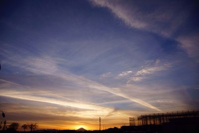 Low angle view of silhouette trees against sky at sunset