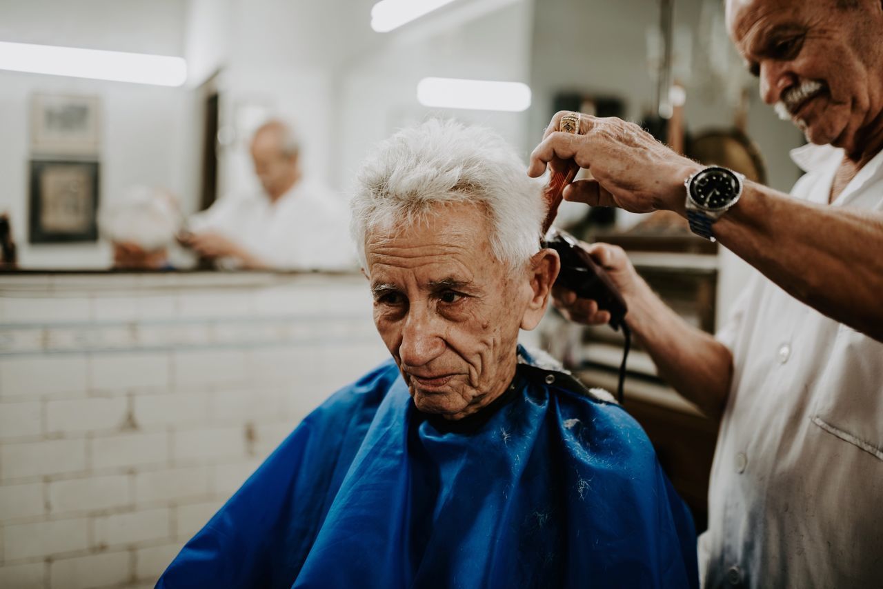 men, males, senior adult, adult, focus on foreground, indoors, lifestyles, real people, two people, senior men, women, mature adult, hairdresser, senior women, occupation, people, incidental people, customer, casual clothing, white hair, mature men, hairstyle, barber