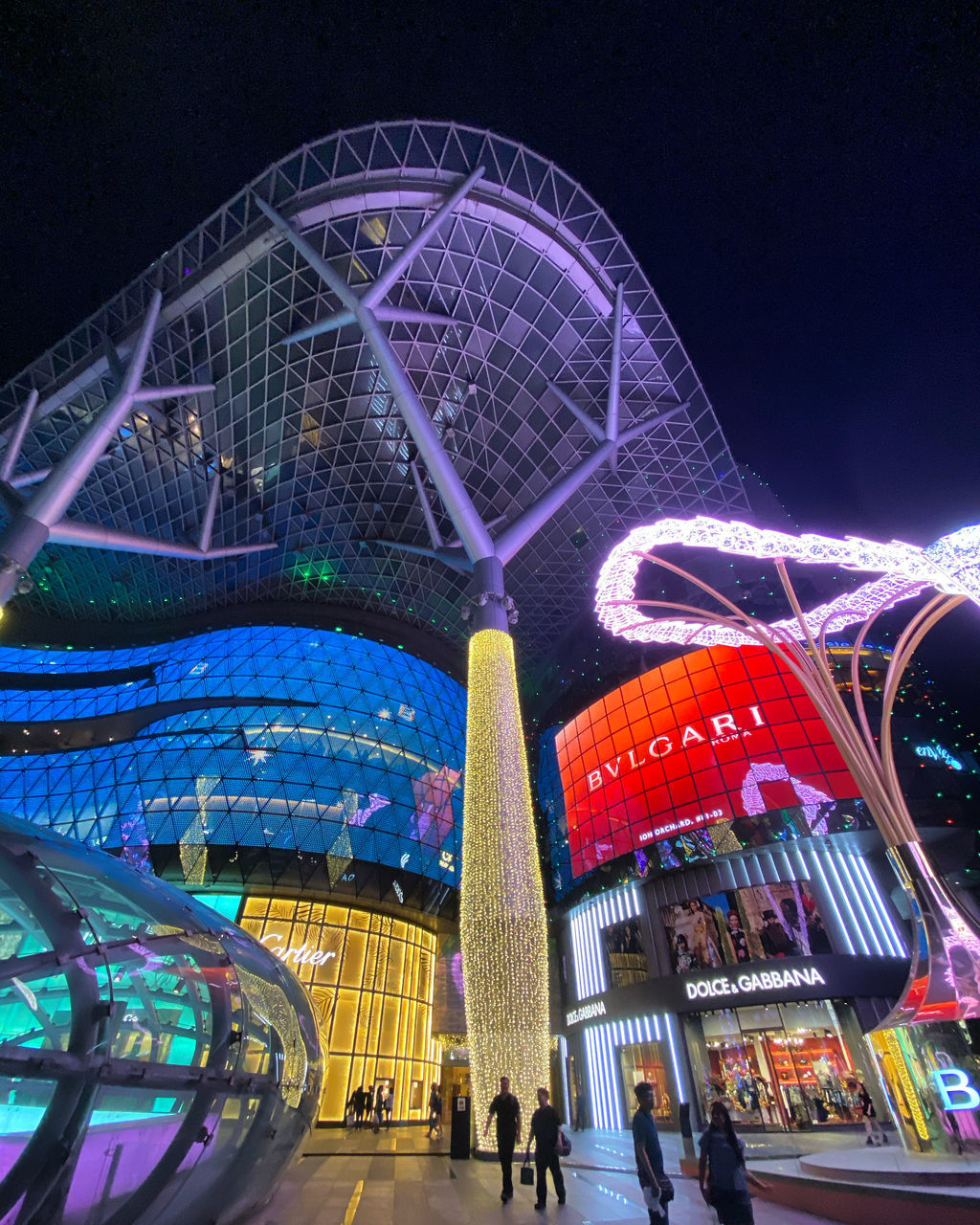 LOW ANGLE VIEW OF ILLUMINATED FERRIS WHEEL AGAINST SKY