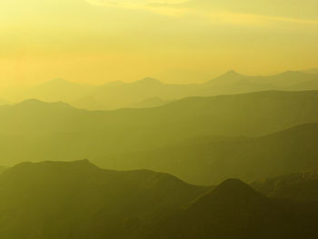 Scenic view of silhouette mountains against sky