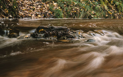 View of water flowing through rocks