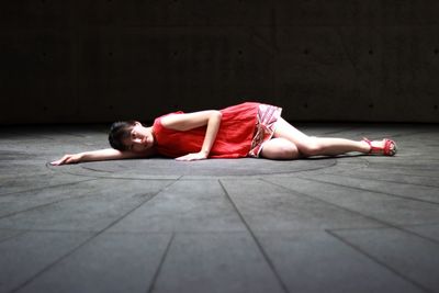 Young woman lying on floor