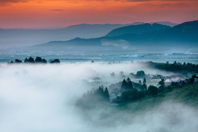 Scenic view of mountains against sky during sunset