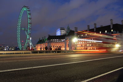 Illuminated ferris wheel at night